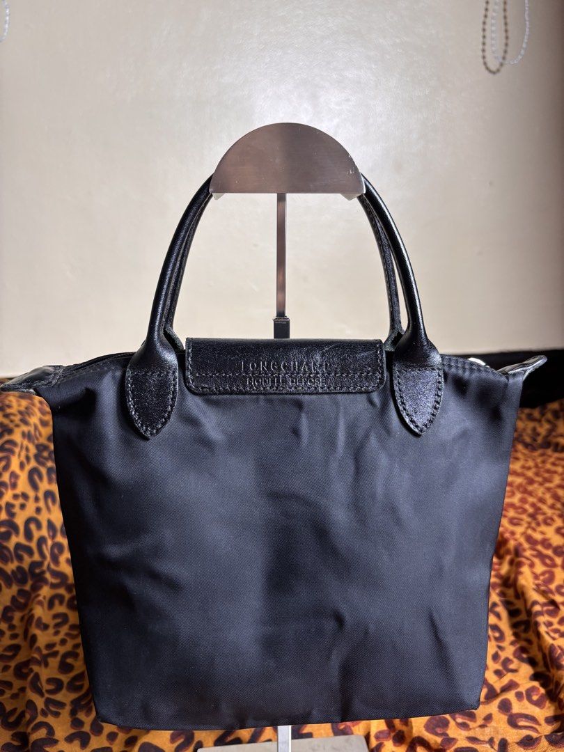 LongChamp Nylon Tote (Category: Tote Bags) located in Manila. Submitted by earlylifecrisis3 (Listing ID 1467458291, Image 3). Description: Condition 8/10 Measure it by inch Width: 10.5 Length: 7.5 Depth: 5 Handle:4 •Refund / Returns not allowed allowed •Please do check the dimensions size on labels sometimes are not accurate on the sizing •Ask me before purchasing.