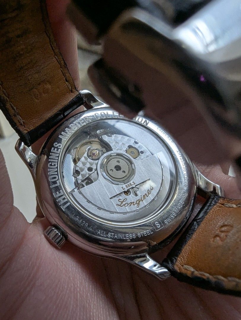 Longines Master Collection Automatic Watch L2.628.4 (Category: Luxury Watches) located in Quezon City. Submitted by dustydialsph (Listing ID 1467534192, Image 2). Description: - Brand: Longines Master Collection - Movement: Automatic (Caliber L888.2) with exhibition caseback - Dial: Silver textured dial with Arabic numerals and date window at 6 o'clock - Case: Stainless steel - Strap: Original dark brown leather strap with winged hourglass deploy