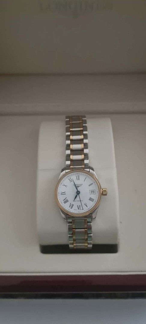Longines Two-Tone Automatic Watch with White Roman Dial (Category: Luxury Watches) located in Manila. Submitted by jakeyprelovedstuff (Listing ID 1467511481, Image 1). Description: - Brand: Longines - Movement: Automatic - Dial: Classic white with elegant Roman numerals - Features: Date window at the 3 o'clock position - Design: Two-tone steel and rose gold bracelet and bezel - Inclusion: Comes with its original branded presentation box - Conditi