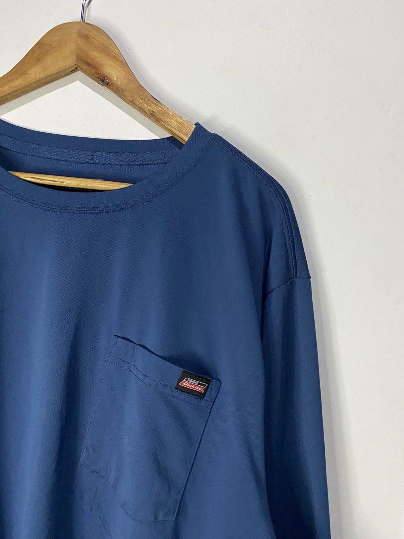 LONGSLEEVE DRYFIT (Category: Coats, Jackets and Outerwear) located in Jaen. Submitted by oshimamark58418 (Listing ID 1467518819, Image 2). Description: - Brand: Genuine Dickies - Type: Longsleeve Dryfit Shirt - Color: Blue - Size: 2XL (Approx. 23" width x 31" length) - Material: 100% Polyester (made in Lesotho) - Features: Chest pocket with Dickies logo patch, moisture-wicking dryfit fabric - Condition: Excellent pre-owned condition.