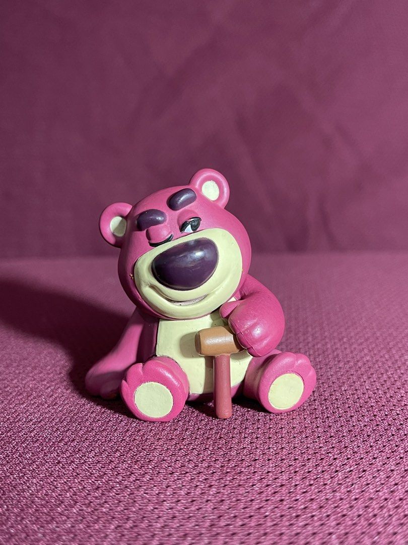Lots-o'-Huggin' Bear (Lotso) (Category: Figurines & Statues) located in Manila. Submitted by dstrangerthings (Listing ID 1467562840, Image 1). Description: - Official Disney Pixar T-Arts merchandise (stamped on the back) - Features Lotso sitting down and holding his signature cane - Great little collectible for Toy Story fans.