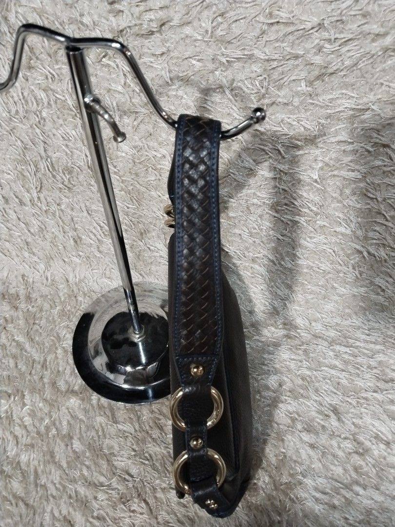 Louis Quatorze Dark Brown Leather Shoulder Bag (Category: Luxury Bags & Wallets) located in Caloocan City. Submitted by jezel07 (Listing ID 1467548668, Image 3). Description: - Brand: Louis Quatorze - Material: Dark brown textured leather with blue contrast stitching - Hardware: Gold-tone rings and stud-secured front flap with embossed logo - Strap: Woven leather strap details - Interior: Blue monogram fabric lining with one zipper pocket and one