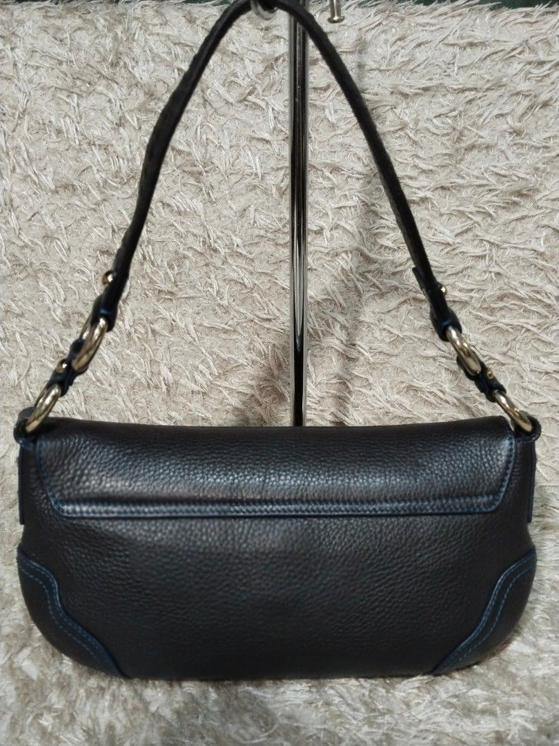 Louis Quatorze Dark Brown Leather Shoulder Bag (Category: Luxury Bags & Wallets) located in Caloocan City. Submitted by jezel07 (Listing ID 1467548668, Image 2). Description: - Brand: Louis Quatorze - Material: Dark brown textured leather with blue contrast stitching - Hardware: Gold-tone rings and stud-secured front flap with embossed logo - Strap: Woven leather strap details - Interior: Blue monogram fabric lining with one zipper pocket and one