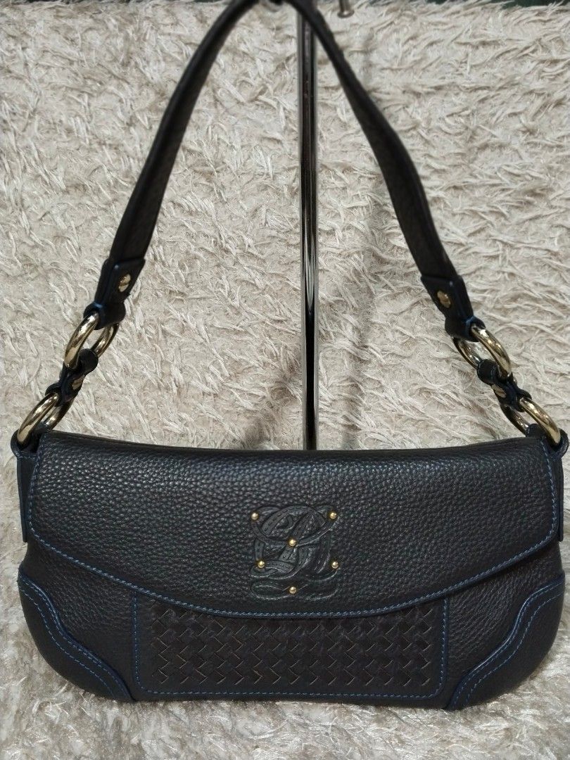 Louis Quatorze Dark Brown Leather Shoulder Bag (Category: Luxury Bags & Wallets) located in Caloocan City. Submitted by jezel07 (Listing ID 1467548668, Image 1). Description: - Brand: Louis Quatorze - Material: Dark brown textured leather with blue contrast stitching - Hardware: Gold-tone rings and stud-secured front flap with embossed logo - Strap: Woven leather strap details - Interior: Blue monogram fabric lining with one zipper pocket and one