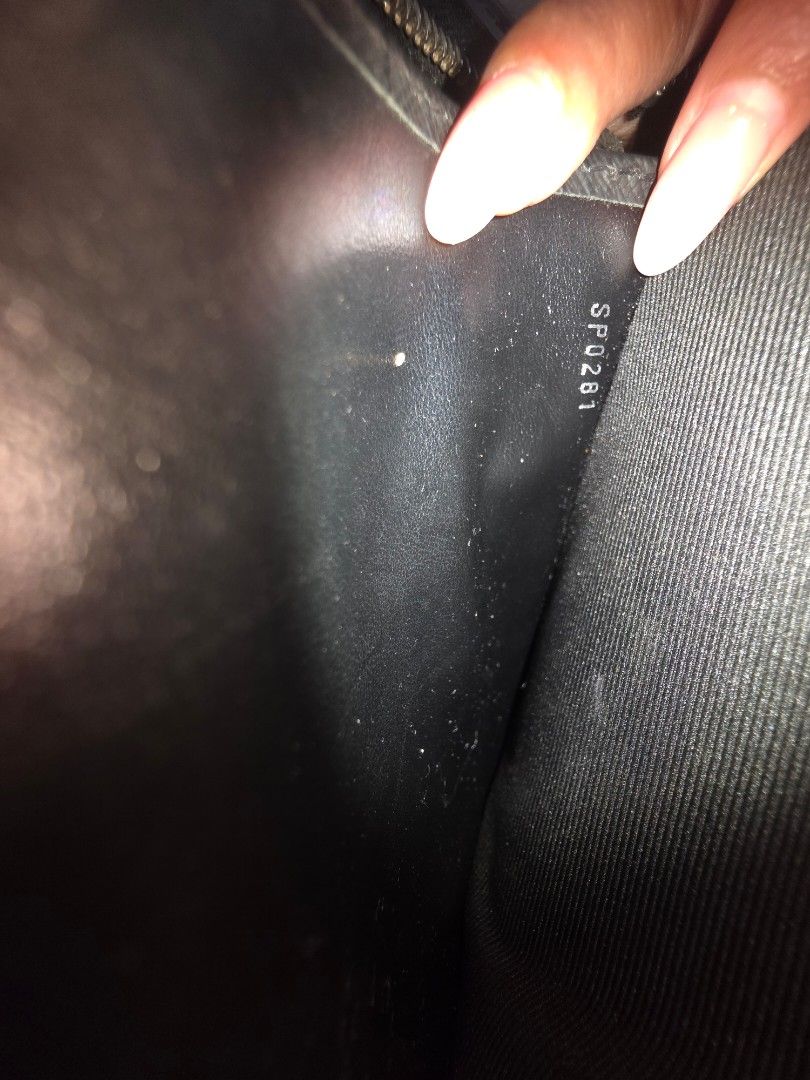 Louis Vuitton Black Pouch with Dust Bag (Category: Luxury Bags & Wallets) located in Pasay City. Submitted by bosungkim32577 (Listing ID 1467597637, Image 1). Description: - Brand: Louis Vuitton - Color: Black Leather - Origin: Made in France - Date Code: SP0281 - Features: Interior card slots, silver hardware, and smooth zip closure - Inclusion: Original dust bag included - Condition: Clean interior, smooth zipper, with minimal signs of wear on 