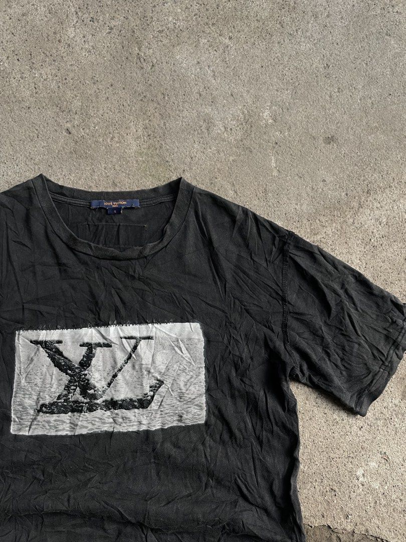 Louis Vuitton Black T-Shirt Size S (Category: Tshirts & Polo Shirts ) located in Polomolok. Submitted by madagascarts (Listing ID 1467503833, Image 3). Description: - Brand: Louis Vuitton - Size: S (Relaxed fit) - Color: Black - Details: Graphic LV print patch on chest, classic crew neck, branded collar tag, signature orange woven label on upper back - Material: Lightweight cotton - Condition: Pre-owned with natural fading and wash wear throughou