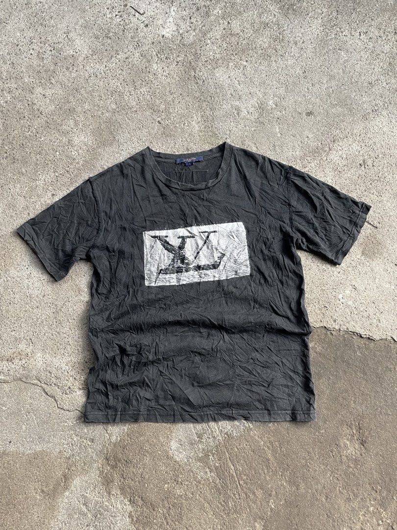 Louis Vuitton Black T-Shirt Size S (Category: Tshirts & Polo Shirts ) located in Polomolok. Submitted by madagascarts (Listing ID 1467503833, Image 1). Description: - Brand: Louis Vuitton - Size: S (Relaxed fit) - Color: Black - Details: Graphic LV print patch on chest, classic crew neck, branded collar tag, signature orange woven label on upper back - Material: Lightweight cotton - Condition: Pre-owned with natural fading and wash wear throughou