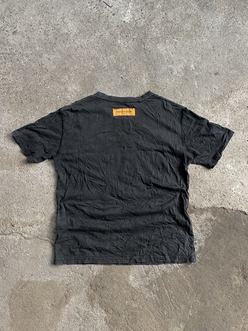Louis Vuitton Black T-Shirt Size S (Category: Tshirts & Polo Shirts ) located in Polomolok. Submitted by madagascarts (Listing ID 1467503833, Image 2). Description: - Brand: Louis Vuitton - Size: S (Relaxed fit) - Color: Black - Details: Graphic LV print patch on chest, classic crew neck, branded collar tag, signature orange woven label on upper back - Material: Lightweight cotton - Condition: Pre-owned with natural fading and wash wear throughou