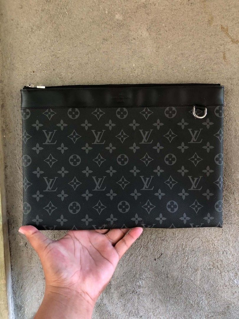 Louis Vuitton Clutch (Category: Luxury Bags & Wallets) located in Manila. Submitted by lumang__gamit00 (Listing ID 1467398919, Image 1). Description: The item in the image resembles a Louis Vuitton Monogram Discovery Pochette Eclipse Clutch.