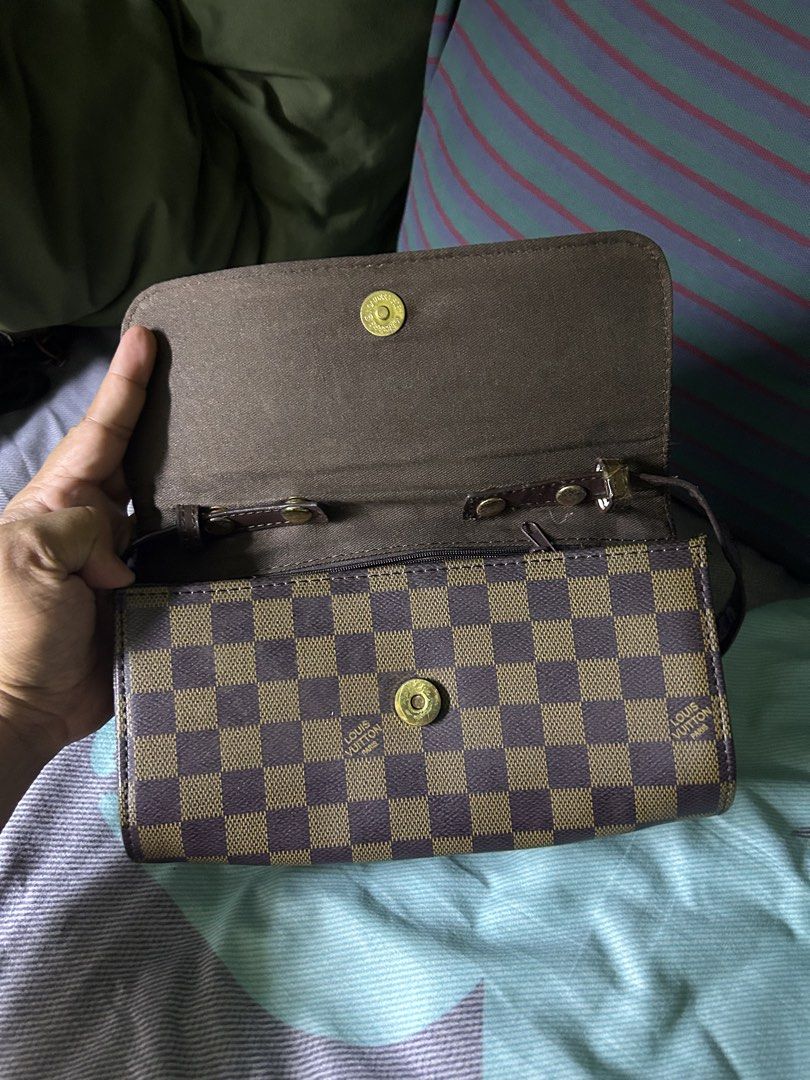 Louis Vuitton Damier Ebene Canvas Shoulder Bag (Category: Shoulder Bags) located in Quezon City. Submitted by thriftxgoods (Listing ID 1467437143, Image 3). Description: - Brown checkerboard canvas design with a dark brown shoulder strap - Secure flap closure with a magnetic snap button - Fabric-lined interior featuring a convenient zippered center divider - Additional inner zipper pocket for secure storage - Finished with an interior leather tag