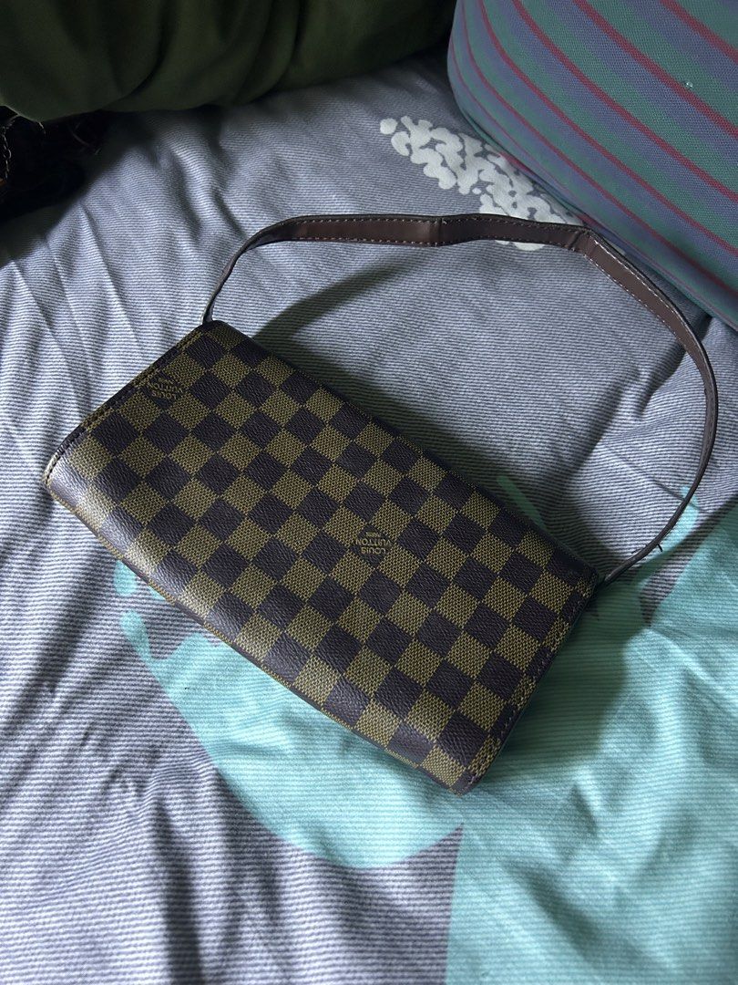 Louis Vuitton Damier Ebene Canvas Shoulder Bag (Category: Shoulder Bags) located in Quezon City. Submitted by thriftxgoods (Listing ID 1467437143, Image 2). Description: - Brown checkerboard canvas design with a dark brown shoulder strap - Secure flap closure with a magnetic snap button - Fabric-lined interior featuring a convenient zippered center divider - Additional inner zipper pocket for secure storage - Finished with an interior leather tag