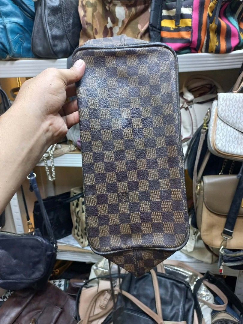 Louis Vuitton Damier Ebene Neverfull Tote Bag (Category: Luxury Bags & Wallets) located in Manila. Submitted by del_thrifts03 (Listing ID 1467375248, Image 3). Description: - Brand/Model: Louis Vuitton Damier Ebene Canvas Tote - Print: Classic brown and dark brown checkerboard - Features: Double leather shoulder straps, adjustable side laces, and spacious interior - Condition: Minor wear on leather trim/edges, slight hardware fading, clean interi