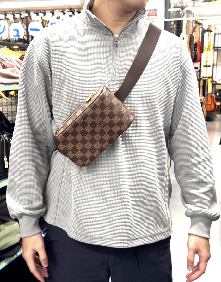 Louis Vuitton Geronimos Damier Ebene Sling Bag (Category: Luxury Bags & Wallets) located in Manila. Submitted by sunnysells08 (Listing ID 1467574260, Image 2). Description: - Authentic Louis Vuitton Geronimos sling bag in Damier Ebene canvas - Classic brown checkered pattern with gold-tone hardware - Secure top zip closure - Comfortable, adjustable dark brown fabric strap for crossbody wear - Compact size, ideal for daily errands and travel - Wit