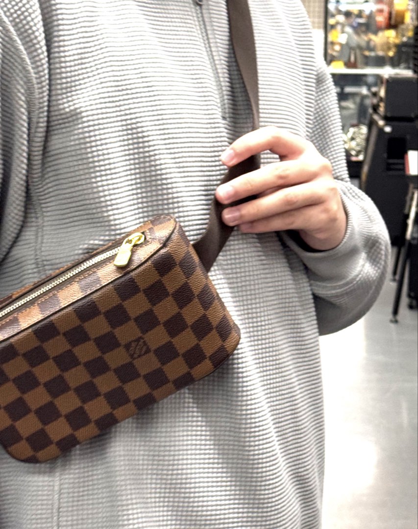 Louis Vuitton Geronimos Damier Ebene Sling Bag (Category: Luxury Bags & Wallets) located in Manila. Submitted by sunnysells08 (Listing ID 1467574260, Image 1). Description: - Authentic Louis Vuitton Geronimos sling bag in Damier Ebene canvas - Classic brown checkered pattern with gold-tone hardware - Secure top zip closure - Comfortable, adjustable dark brown fabric strap for crossbody wear - Compact size, ideal for daily errands and travel - Wit