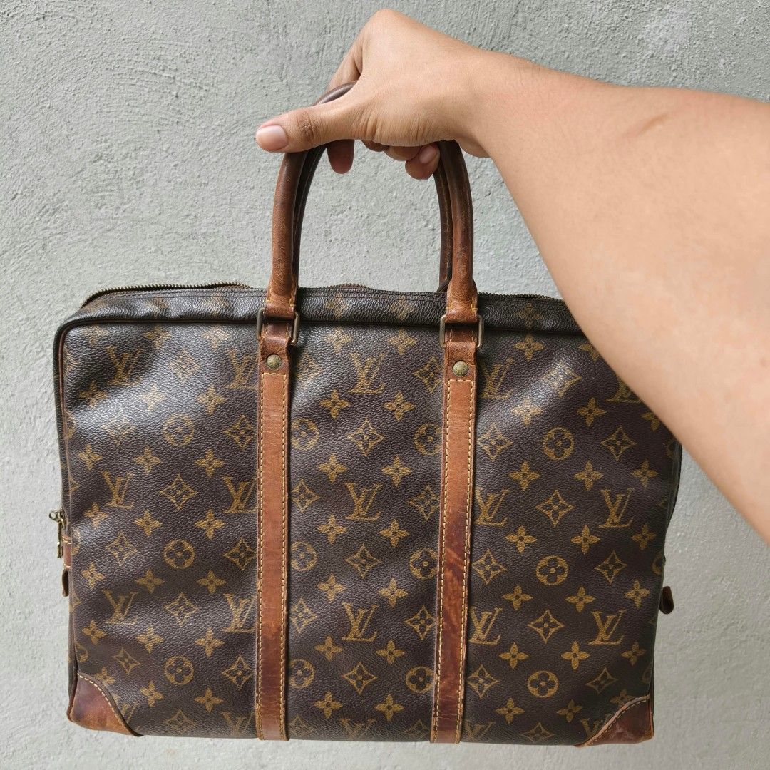 Louis Vuitton Monogram Briefcase Handbag (Category: Luxury Bags & Wallets) located in Lapu Lapu. Submitted by margaux099 (Listing ID 1467461298, Image 2). Description: - Classic brown monogram canvas design - Dual top handles and stylish vertical front leather straps - Brass hardware featuring a padlock (stamped Made in France) and engraved zipper pulls - Side metal rings with LV stamp details - Spacious interior for daily documents and essential