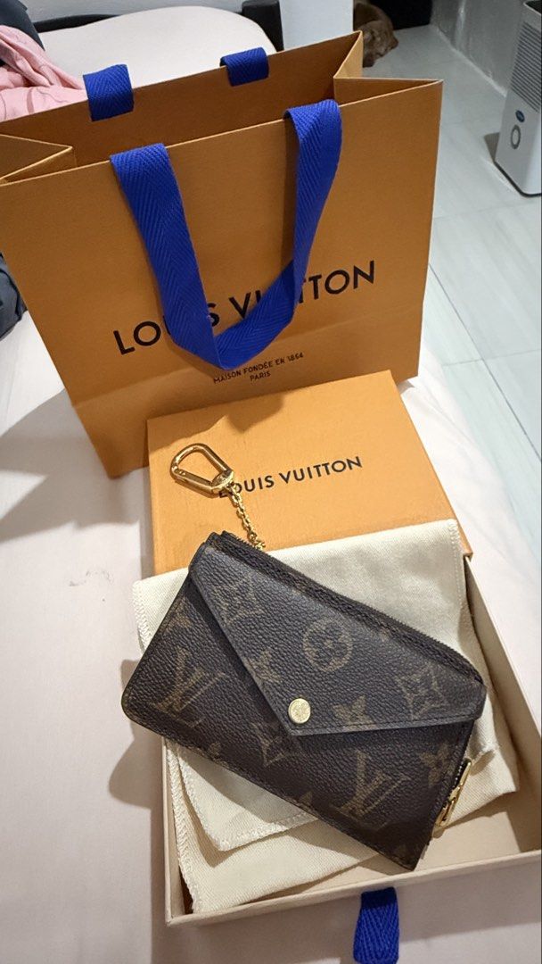 Louis Vuitton Monogram Key Pouch Wallet (Category: Luxury Bags & Wallets) located in Caloocan City. Submitted by reizbuenaventura (Listing ID 1467591023, Image 2). Description: - Authentic monogram canvas design - Features gold-tone hardware and convenient chain attachment - Envelope-style pocket on one side and card slots on the other - Includes original dust bag, presentation box, and branded shopping bag - Brand new and in pristine condition -