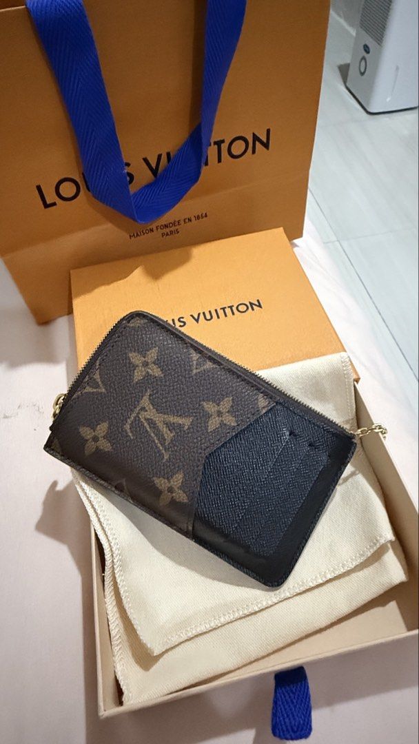 Louis Vuitton Monogram Key Pouch Wallet (Category: Luxury Bags & Wallets) located in Caloocan City. Submitted by reizbuenaventura (Listing ID 1467591023, Image 1). Description: - Authentic monogram canvas design - Features gold-tone hardware and convenient chain attachment - Envelope-style pocket on one side and card slots on the other - Includes original dust bag, presentation box, and branded shopping bag - Brand new and in pristine condition -