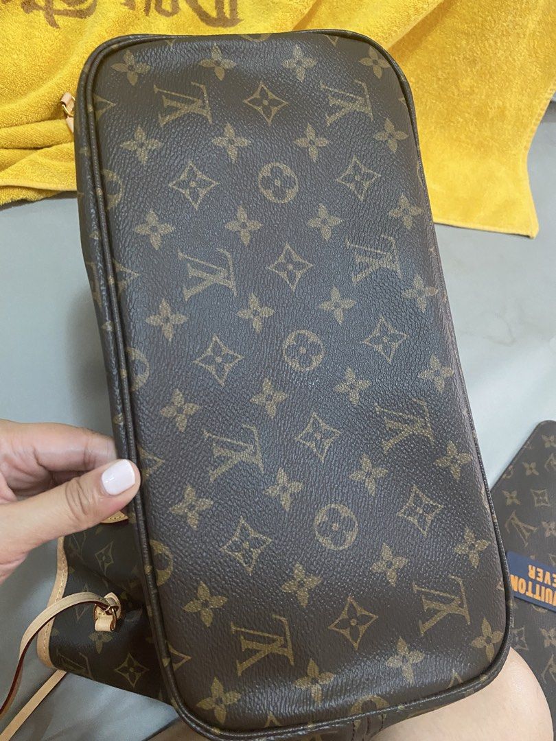 Louis Vuitton Monogram Neverfull MM Tote Bag (Category: Luxury Bags & Wallets) located in San Pablo. Submitted by butterfly1987_ (Listing ID 1467600204, Image 2). Description: - Authentic Monogram Canvas with untreated cowhide leather trim - Classic red striped textile interior lining - Interior zippered pocket with leather heat stamp - Premium gold-tone hardware - Comfortable dual flat shoulder straps - Adjustable side leather laces - Made in Fr