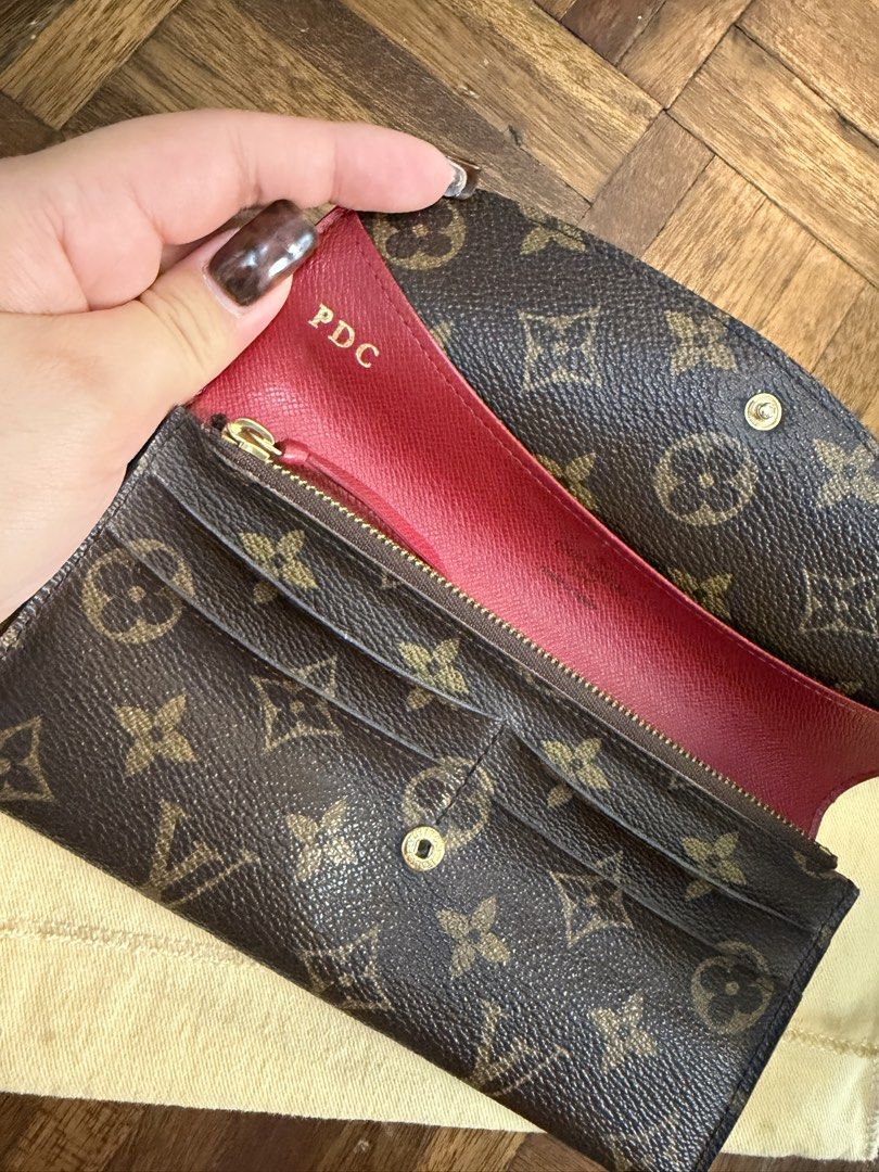 Louis Vuitton Monogram Sarah Wallet with Hot Stamp PDC (Category: Luxury Bags & Wallets) located in Manila. Submitted by paupreloveditems88 (Listing ID 1467393082, Image 2). Description: - Authentic Monogram Canvas Exterior - Striking Red Interior Lining with Gold-Tone Hardware - Features: Multiple card slots, zipped coin pocket, and open compartments - Personalized: Hot-stamped initials "PDC" in gold on the inside flap - Inclusion: Comes with or