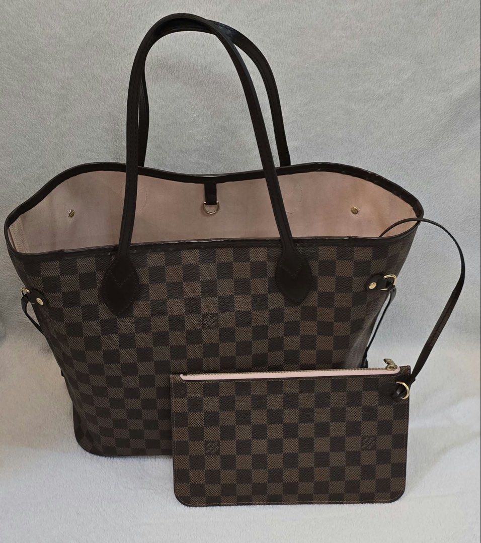 Louis Vuitton Neverfull MM Damier Ebene Pink (Category: Luxury Bags & Wallets) located in Caloocan City. Submitted by kimmndza_176 (Listing ID 1467512330, Image 1). Description: - Authentic Louis Vuitton Neverfull MM in classic Damier Ebene canvas - Features a chic pink interior lining with a striped textile design - Includes the matching detachable pouch - Accented with cowhide leather trim and gold-tone hardware - Practical interior zip pocket 