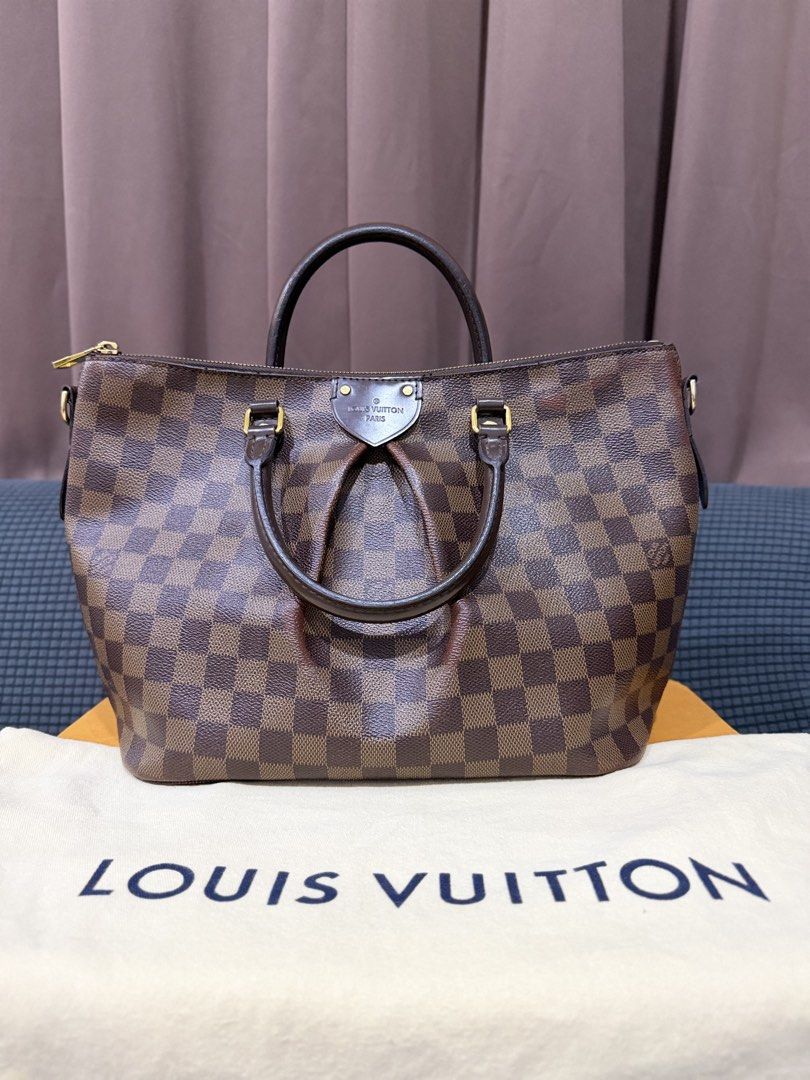 Louis Vuitton Siena MM in Damier Ebene (Category: Luxury Bags & Wallets) located in Mandaluyong City. Submitted by shelzzyyy (Listing ID 1467526902, Image 2). Description: Brand: Louis Vuitton (Guaranteed Authentic) Model: Siena MM Status: Pre-loved item with minor color fading Style: Satchel / Shoulder Bag / Crossbody - Comes with dust bag, box, paper bag, receipt, care booklet and materials tag - Hot stamped with initials Overall Condition: Pre