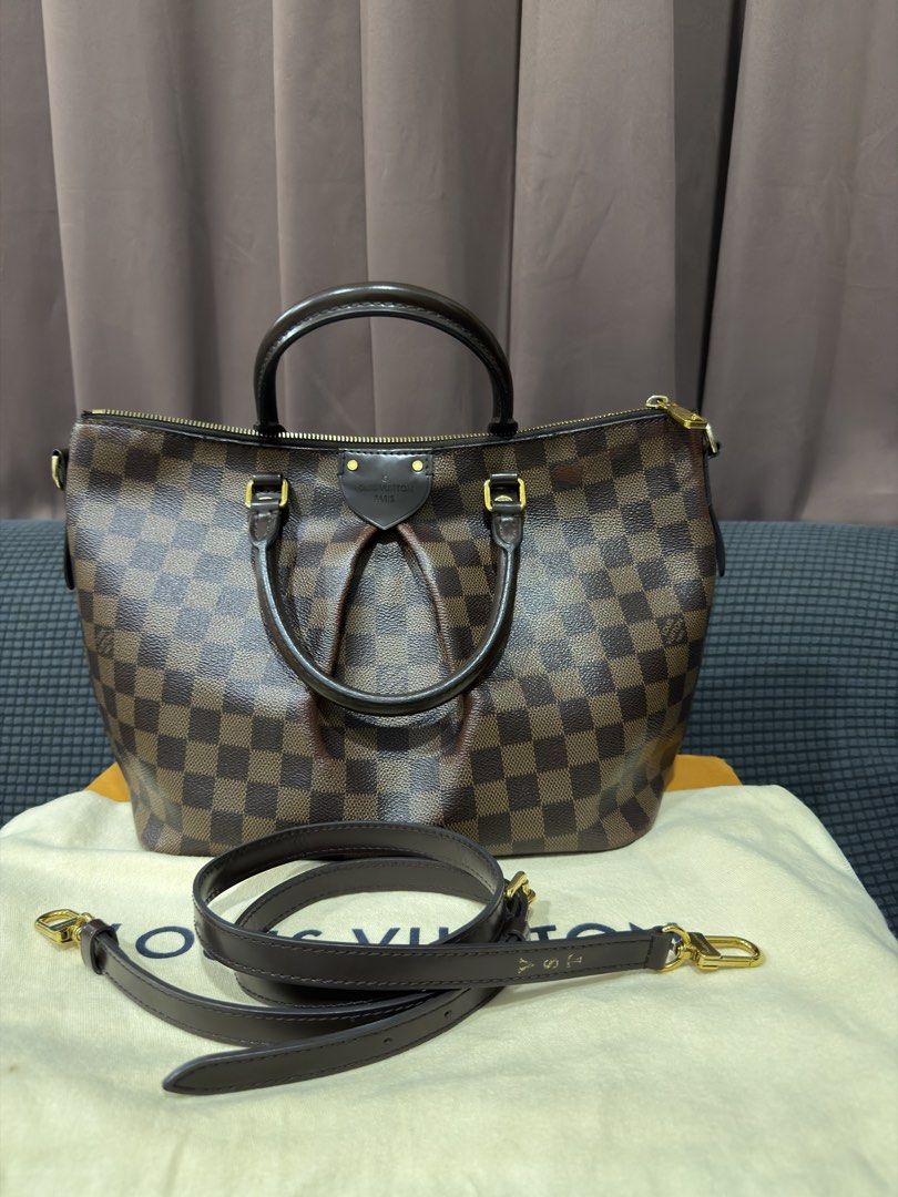 Louis Vuitton Siena MM in Damier Ebene (Category: Luxury Bags & Wallets) located in Mandaluyong City. Submitted by shelzzyyy (Listing ID 1467526902, Image 3). Description: Brand: Louis Vuitton (Guaranteed Authentic) Model: Siena MM Status: Pre-loved item with minor color fading Style: Satchel / Shoulder Bag / Crossbody - Comes with dust bag, box, paper bag, receipt, care booklet and materials tag - Hot stamped with initials Overall Condition: Pre