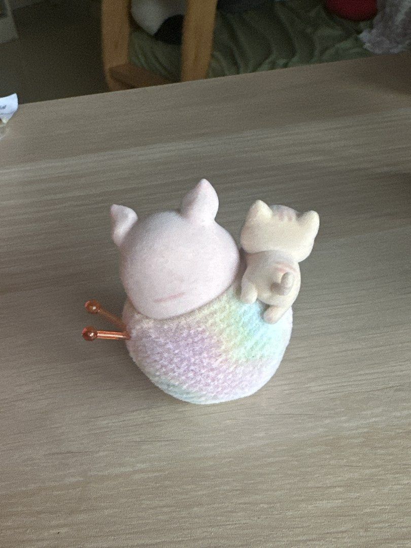 Lulu the Pig (Category: Designer & Blind Box Toys) located in Quezon City. Submitted by shopfinesse (Listing ID 1467397784, Image 3). Description: - Adorable flocked figurine set with a large pink pig and tiny white kitten - Animals are sitting together on a pastel rainbow ball of yarn with knitting needles - Features a smooth, soft velvety texture - Perfect as cute desk decor or shelf ornament.