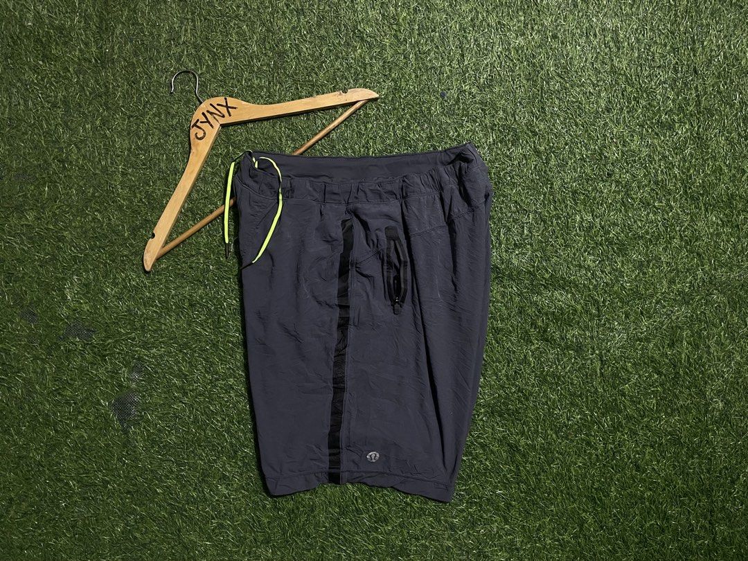 Lululemon Athletic Shorts Grey with Neon Yellow Drawstring (Category: Shorts) located in Las Pinas. Submitted by jynxdefant26140 (Listing ID 1467519844, Image 1). Description: - Brand: Lululemon - Color: Dark grey with neon yellow drawstring - Material: Lightweight, breathable athletic fabric - Features: Adjustable drawstring with branded metal tips, black mesh side panels for ventilation, small secure zipper pocket - Details: Reflective Lululemo