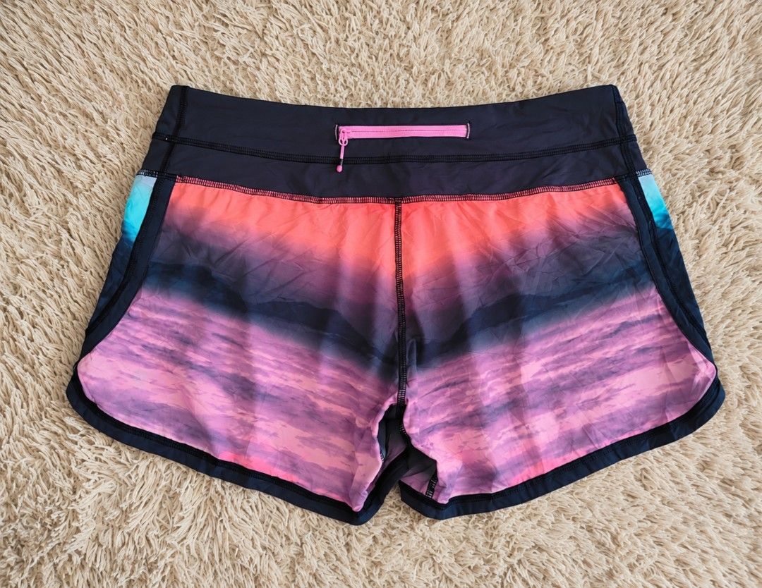 Lululemon Athletic Shorts Size 8 Multi Color Gradient (Category: Shorts) located in San Carlos City. Submitted by chinx008 (Listing ID 1467485433, Image 2). Description: - Brand: Lululemon - Size: 8 - Design: Stunning multi-color gradient (shades of blue, teal, purple, and pink) - Features: Wide waistband with built-in liner - Storage: Handy back zipper pocket for keys or cards - Safety: Reflective logo detail on the leg hem - Ideal for: Running,