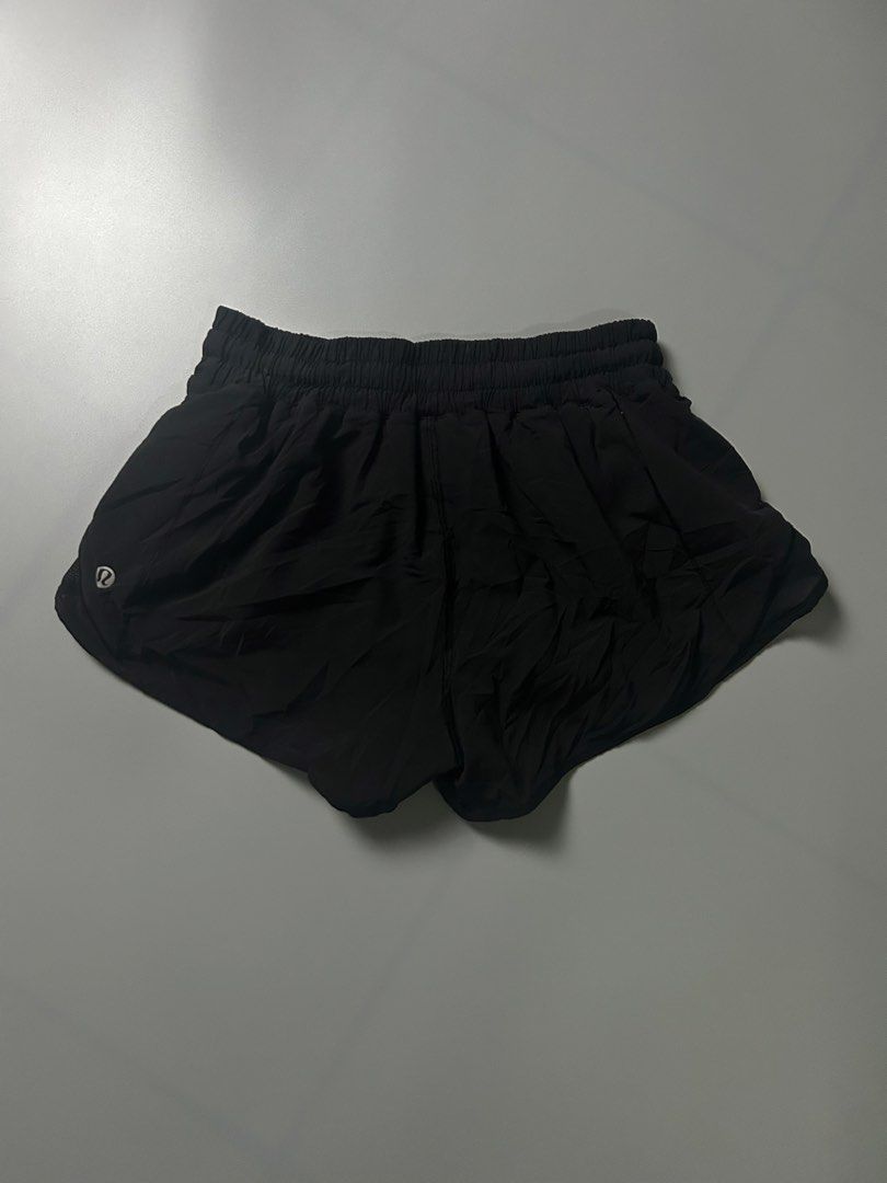 Lululemon Black Athletic Shorts Size 4 (Category: Shorts) located in Tacloban City. Submitted by azthrifting24 (Listing ID 1467578357, Image 1). Description: - Brand: Lululemon - Color: Black - Size: 4 (verified by size dot inside the pocket) - Material: Lightweight, breathable fabric - Features: Elastic waistband, side mesh panels, and reflective logo - Condition: Great for running, workouts, and active lifestyle.