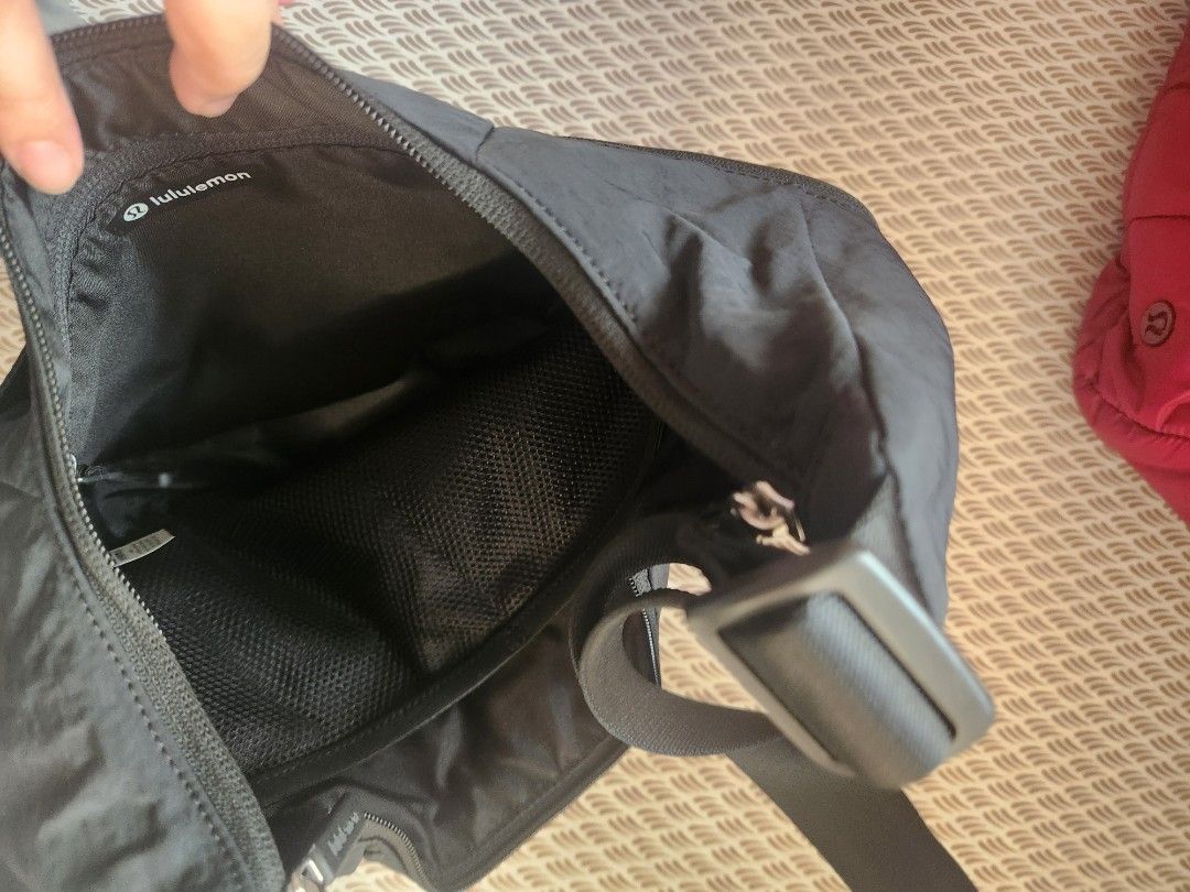 Lululemon Black Crossbody Shoulder Bag (Category: Cross-body Bags) located in Makati City. Submitted by mikamix (Listing ID 1467601325, Image 3). Description: - Brand: Lululemon - Color: Classic Black - Material: Lightweight, durable nylon - Strap: Adjustable for custom fit - Pockets: Main zip compartment, 2 zipped front pockets with patterned pull cords, and interior mesh slip pockets - Ideal for: Daily errands, travel, and hands-free convenienc