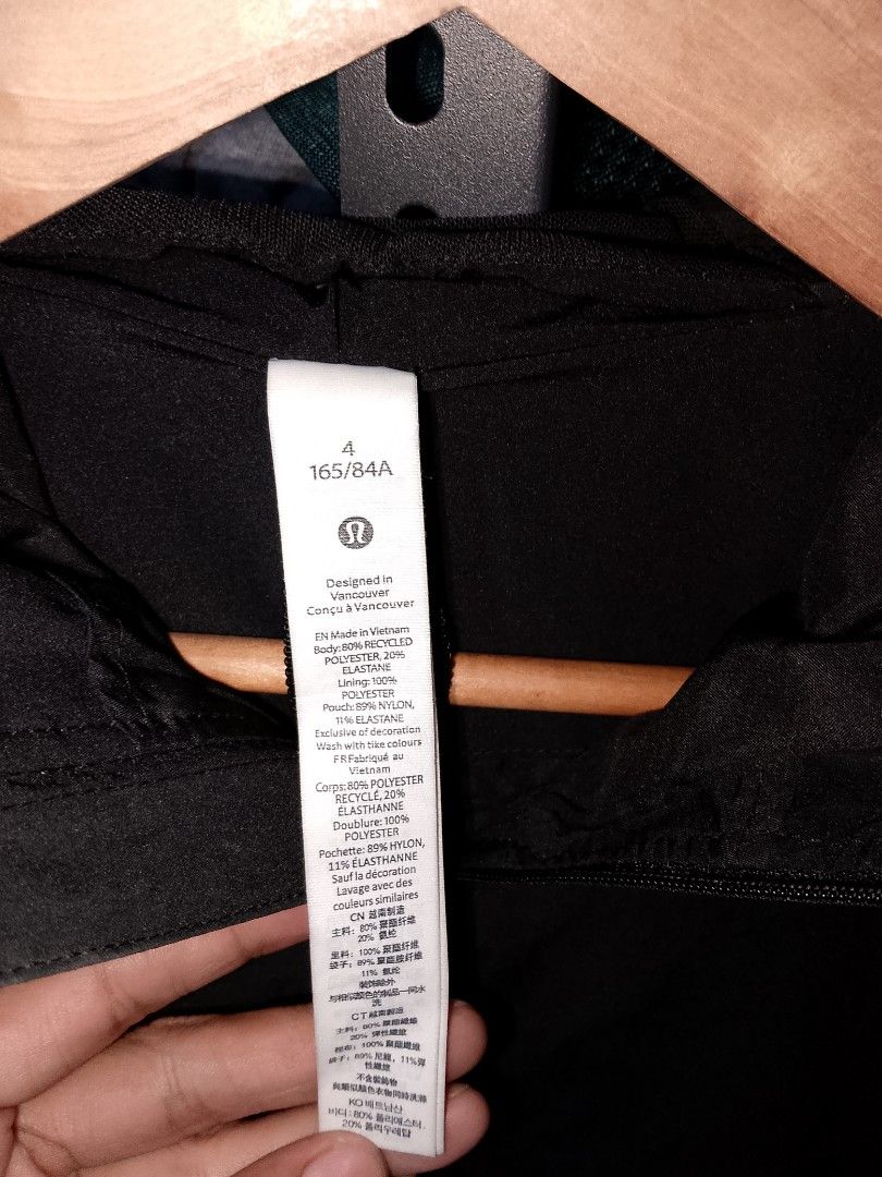 Lululemon Black Hooded Jacket Size 4 (Category: Coats, Jackets and Outerwear) located in Manila. Submitted by mjthrifted_second (Listing ID 1467420523, Image 3). Description: - Brand: Lululemon - Size: 4 (165/84A) -Dimes 20/26 - Color: Classic solid black - Material: Lightweight recycled polyester and elastane - Features: Full zip with signature logo pull, attached hood, adjustable drawstring hem, and reflective logo on sleeve cuff - Condition: E
