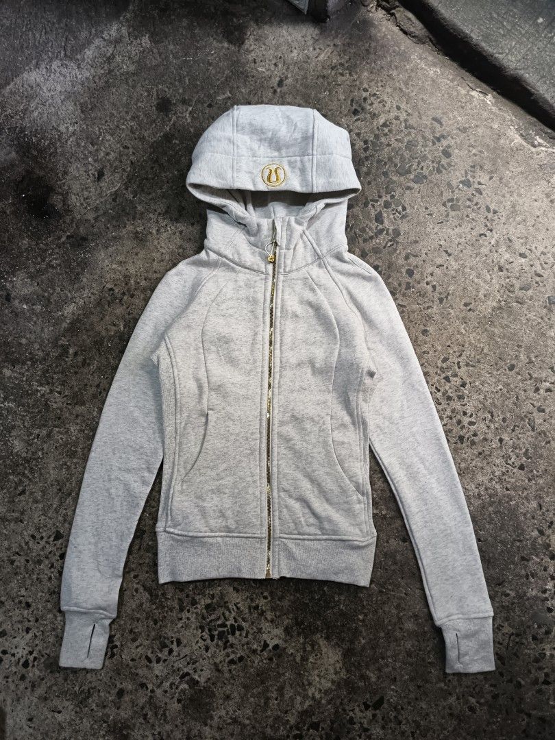 Lululemon Define Jacket Grey Gold Logo Size 4 (Category: Coats, Jackets and Outerwear) located in Caloocan City. Submitted by gemfinder669 (Listing ID 1467471608, Image 1). Description: - Brand: Lululemon - Style: Grey marled cotton zip-up hoodie - Size: 4 (170/80A) - Details: Shiny gold zipper, embroidered logo on hood, drawstring adjustments with gold hardware - Features: Built-in thumbholes on long cuffs, front pockets, structured fit - Condit