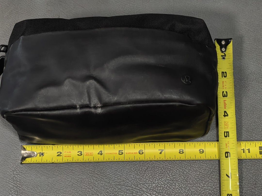 Lululemon Dopp Kit Travel Pouch Black (Category: Belt bags, Clutches and Pouches) located in Cagayan de Oro. Submitted by pootx (Listing ID 1467515106, Image 2). Description: - Brand: Lululemon - Color: Classic Black - Dimensions: 23 x 11.5 cm (Compact size) - Material: Water-repellent fabric with durable polyurethane contrast panels - Storage: Interior mesh pockets with secure YKK zipper closure - Features: Convenient side grab handle - Care Ins