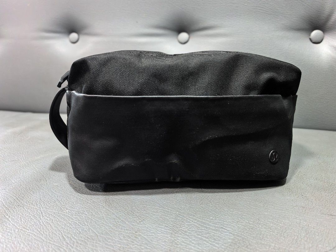 Lululemon Dopp Kit Travel Pouch Black (Category: Belt bags, Clutches and Pouches) located in Cagayan de Oro. Submitted by pootx (Listing ID 1467515106, Image 1). Description: - Brand: Lululemon - Color: Classic Black - Dimensions: 23 x 11.5 cm (Compact size) - Material: Water-repellent fabric with durable polyurethane contrast panels - Storage: Interior mesh pockets with secure YKK zipper closure - Features: Convenient side grab handle - Care Ins