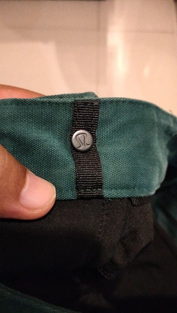 Lululemon Green Pants Size 32 (Category: Jeans) located in Angeles City. Submitted by mightywhale_13072f (Listing ID 1467411330, Image 2). Description: - Brand: Lululemon - Color: Dark Green - Size: Waist 32-33. L42 - Condition: very good - Details: Classic button closure, belt loops, functional back pockets - Branding: Subtle logo tag on back waistband and inside lining - Material: Durable, structured fabric.