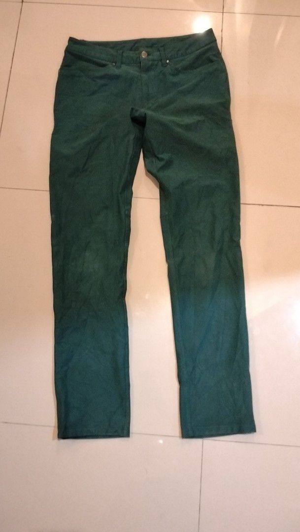 Lululemon Green Pants Size 32 (Category: Jeans) located in Angeles City. Submitted by mightywhale_13072f (Listing ID 1467411330, Image 1). Description: - Brand: Lululemon - Color: Dark Green - Size: Waist 32-33. L42 - Condition: very good - Details: Classic button closure, belt loops, functional back pockets - Branding: Subtle logo tag on back waistband and inside lining - Material: Durable, structured fabric.