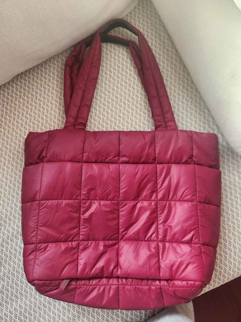 Lululemon Quilted Grid Tote Bag (Category: Tote Bags) located in Makati City. Submitted by mikamix (Listing ID 1467601265, Image 2). Description: - Authentic Lululemon quilted tote bag in a stunning dark pink shade - Chic all-over exterior grid stitching pattern - Comfortable dual padded shoulder straps for easy carrying - Secure zippered main closure - Spacious interior designed to hold all your daily essentials - Excellent organization with mul