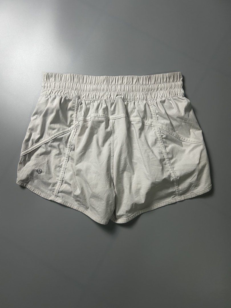 Lululemon Track That Mid-Rise Short 3" (Category: Shorts) located in Tacloban City. Submitted by azthrifting24 (Listing ID 1467578559, Image 1). Description: - Brand: Lululemon - Size: 8 (tag intact) - Color: Neutral light beige - Fit: Mid-rise with a comfortable ribbed waistband - Features: Handy back zip pocket and signature logo near the hem - Material: Lightweight and breathable - Condition: Great for workouts or casual daytime wear.