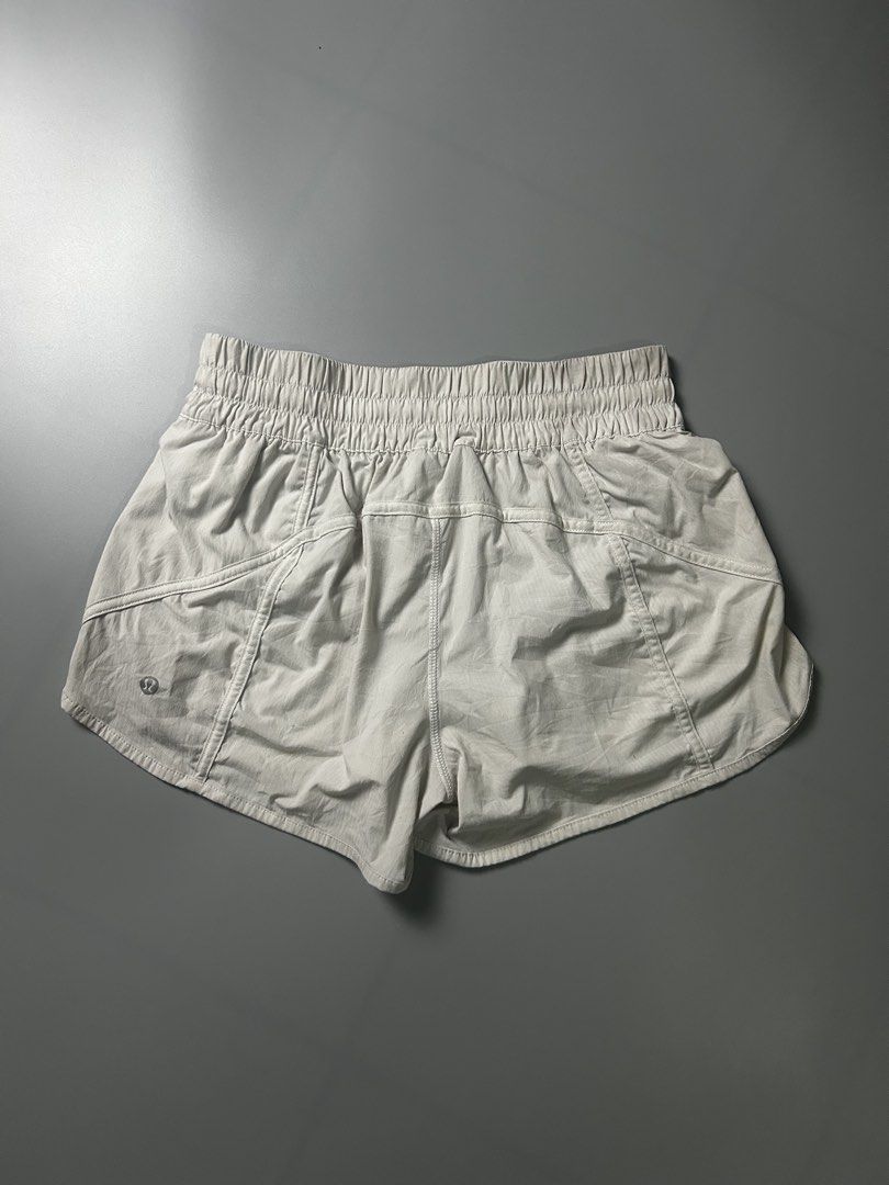 Lululemon Track That Mid-Rise Short 3" (Category: Shorts) located in Tacloban City. Submitted by azthrifting24 (Listing ID 1467578559, Image 2). Description: - Brand: Lululemon - Size: 8 (tag intact) - Color: Neutral light beige - Fit: Mid-rise with a comfortable ribbed waistband - Features: Handy back zip pocket and signature logo near the hem - Material: Lightweight and breathable - Condition: Great for workouts or casual daytime wear.