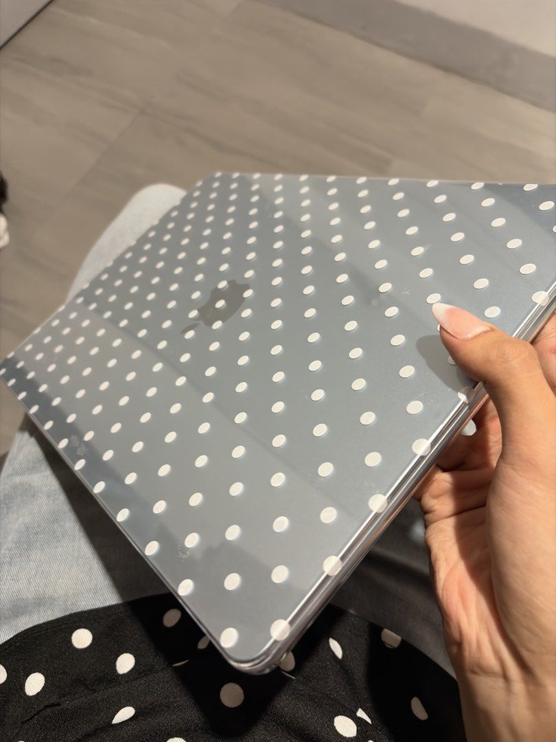 MacBook Air 15” Clear Polka Dot Case (Category: Laptop Bags & Sleeves) located in Mandaluyong City. Submitted by jadetrinidad (Listing ID 1467478050, Image 3). Description: - Clear hard shell design with all-over white polka dots - Fits MacBook Air 15” M2 to M5 - Easy snap-on application for hassle-free installation - Vented bottom panel prevents overheating - Four rubber feet keep your laptop stable and secure - Protects your device from everyda