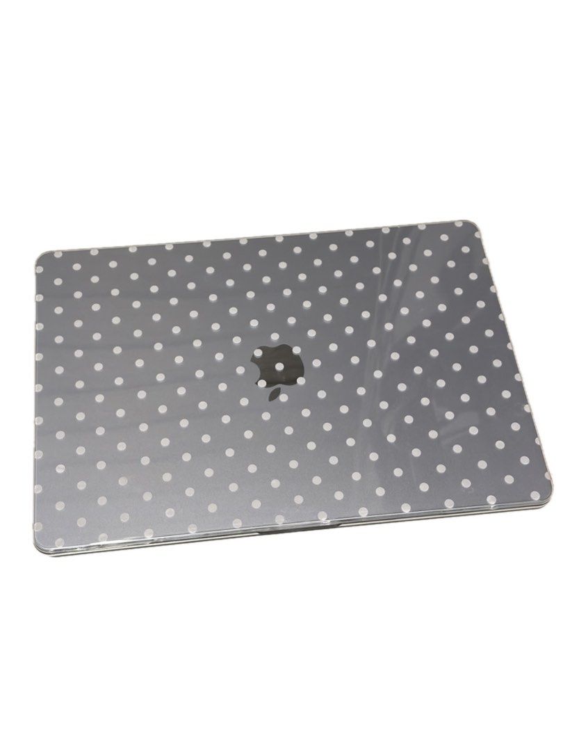 MacBook Air 15” Clear Polka Dot Case (Category: Laptop Bags & Sleeves) located in Mandaluyong City. Submitted by jadetrinidad (Listing ID 1467478050, Image 1). Description: - Clear hard shell design with all-over white polka dots - Fits MacBook Air 15” M2 to M5 - Easy snap-on application for hassle-free installation - Vented bottom panel prevents overheating - Four rubber feet keep your laptop stable and secure - Protects your device from everyda
