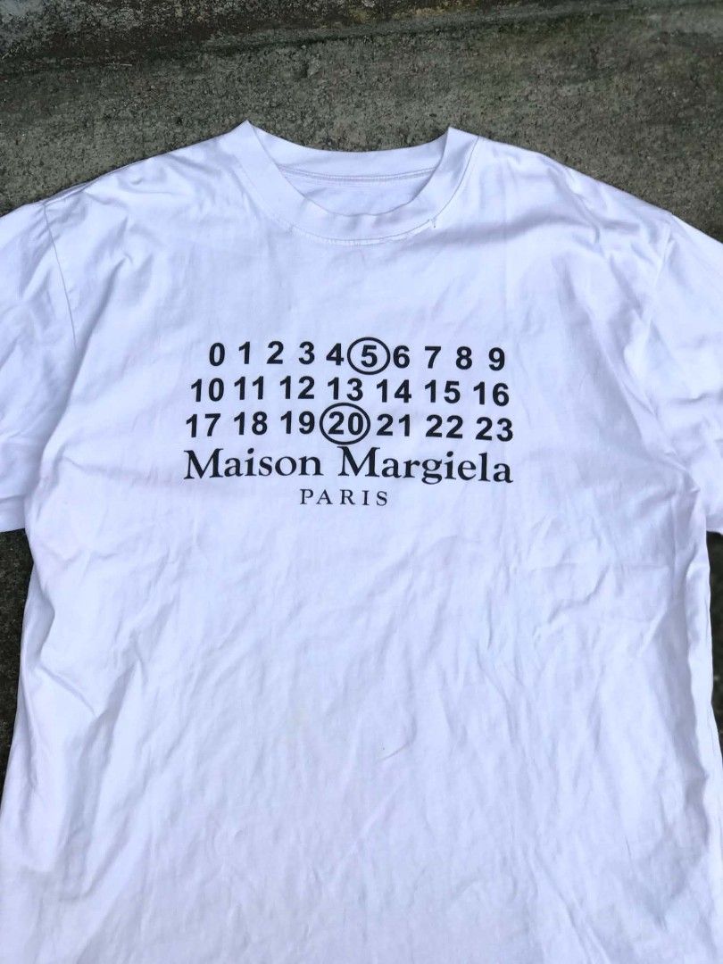 Maison Margiela numeric logo white T-shirt (Category: Activewear) located in Canlaon. Submitted by thriftytrift (Listing ID 1467521207, Image 1). Description: 10/10 color rate dimes:23/29 Condition:9/10.