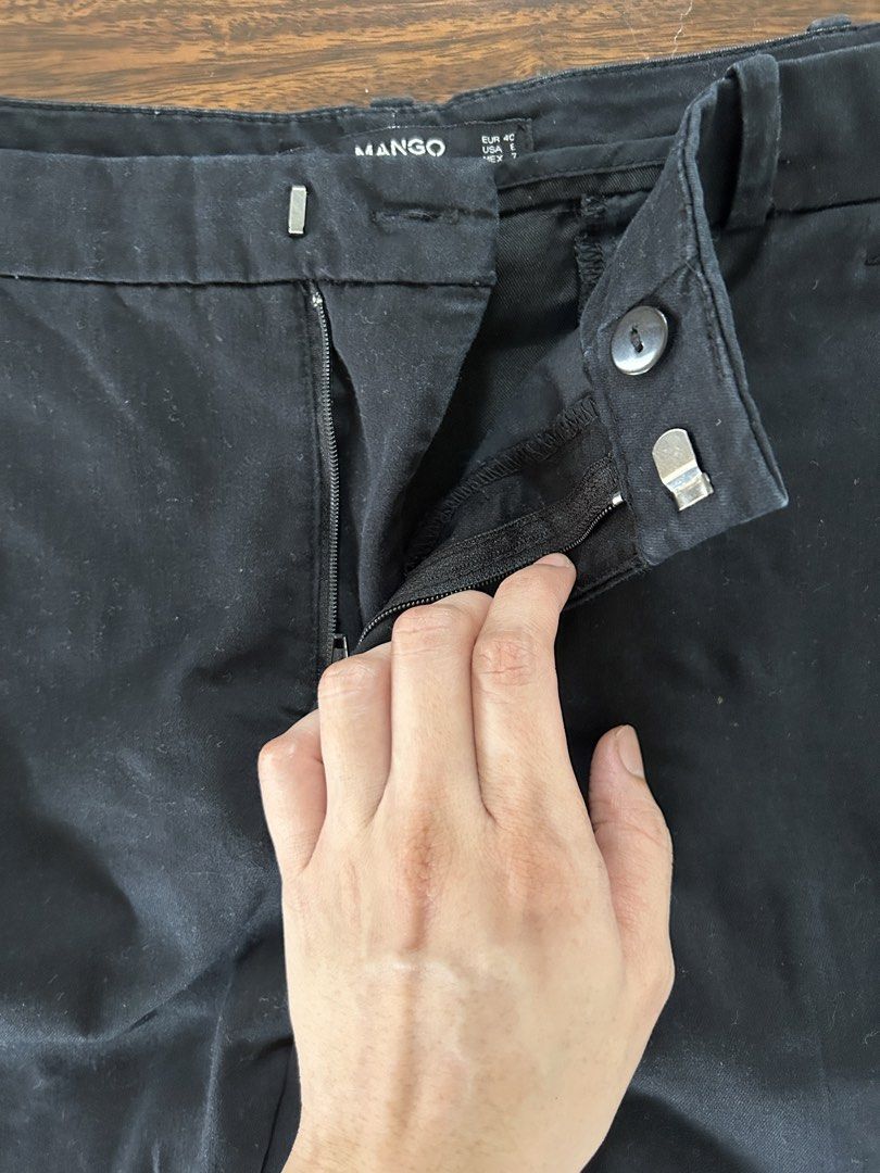 Mango Basics Black Trousers 30" waistline (Category: Jeans) located in Muntinlupa City. Submitted by manikascloset (Listing ID 1467402278, Image 3). Description: - Brand/Model: Mango Basics - Size: EUR 40 / USA E / MEX 7 - Fit: Regular fit, mid-rise waist - Closure: Front zipper and button with belt loops - Condition: Clean black fabric with minimal wear - Style: Versatile staple, easy to pair with blouses, t-shirts, or blazers for work and casua