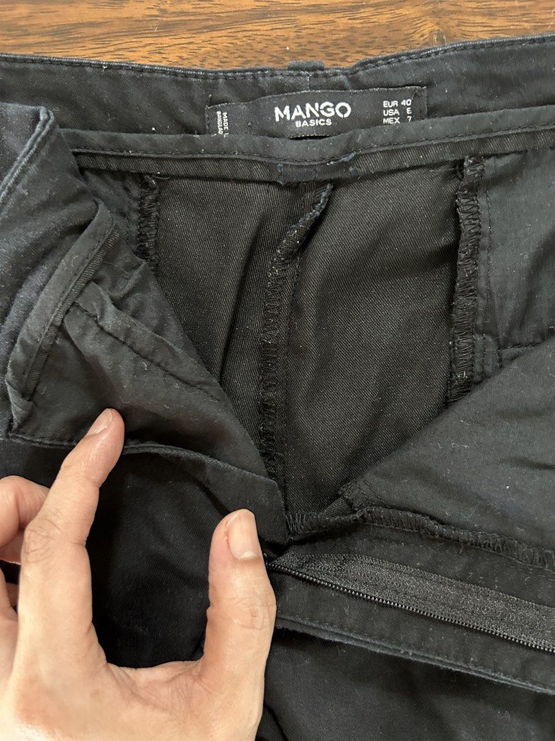Mango Basics Black Trousers 30" waistline (Category: Jeans) located in Muntinlupa City. Submitted by manikascloset (Listing ID 1467402278, Image 2). Description: - Brand/Model: Mango Basics - Size: EUR 40 / USA E / MEX 7 - Fit: Regular fit, mid-rise waist - Closure: Front zipper and button with belt loops - Condition: Clean black fabric with minimal wear - Style: Versatile staple, easy to pair with blouses, t-shirts, or blazers for work and casua