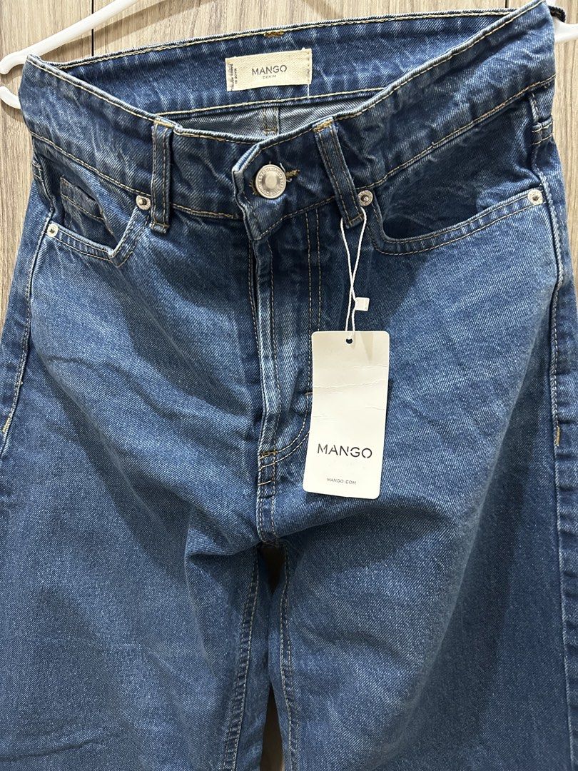 Mango Denim Wide Leg Pants (Category: Jeans) located in Quezon City. Submitted by weyheyvann (Listing ID 1467531149, Image 2). Description: - Brand: Mango - Style: High-waisted wide leg jeans - Wash: Medium blue - Condition: Brand new - Features: Metal button closure, belt loops, classic front pockets - Perfect for everyday wear.