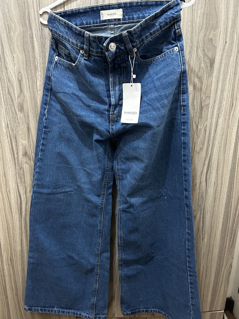 Mango Denim Wide Leg Pants (Category: Jeans) located in Quezon City. Submitted by weyheyvann (Listing ID 1467531149, Image 1). Description: - Brand: Mango - Style: High-waisted wide leg jeans - Wash: Medium blue - Condition: Brand new - Features: Metal button closure, belt loops, classic front pockets - Perfect for everyday wear.