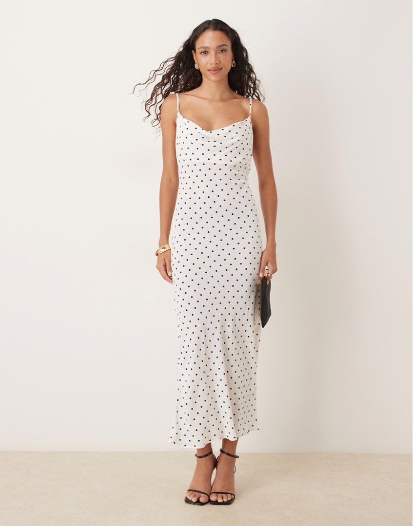 Mango Polka Dot Maxi Dress (Category: Dresses) located in Bacoor. Submitted by hellonikka (Listing ID 1467384383, Image 1). Description: - Brand: MNG - Style: Midi dress with cowl neck and thin spaghetti straps - Pattern: White with all-over black polka dots - Fabric: Lightweight and flowy - Size: S / EUR S / USA 4 / MEX CH - Condition: Worn once, excellent shape.
