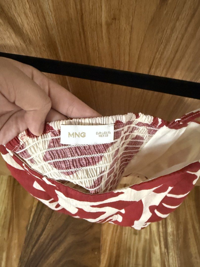 Mango Printed Crop Top Maroon Size XL (Category: Sleeveless) located in Quezon City. Submitted by preloved.lux15 (Listing ID 1467557200, Image 3). Description: - Brand: Mango - Size: XL - Color: Maroon and cream with bold abstract floral print - Design: Square neckline, adjustable thin straps, and smocked elastic back for a comfortable fit - Fabric: Lightweight and breathable - Perfect for: Summer days, best paired with high-waisted shorts or ski
