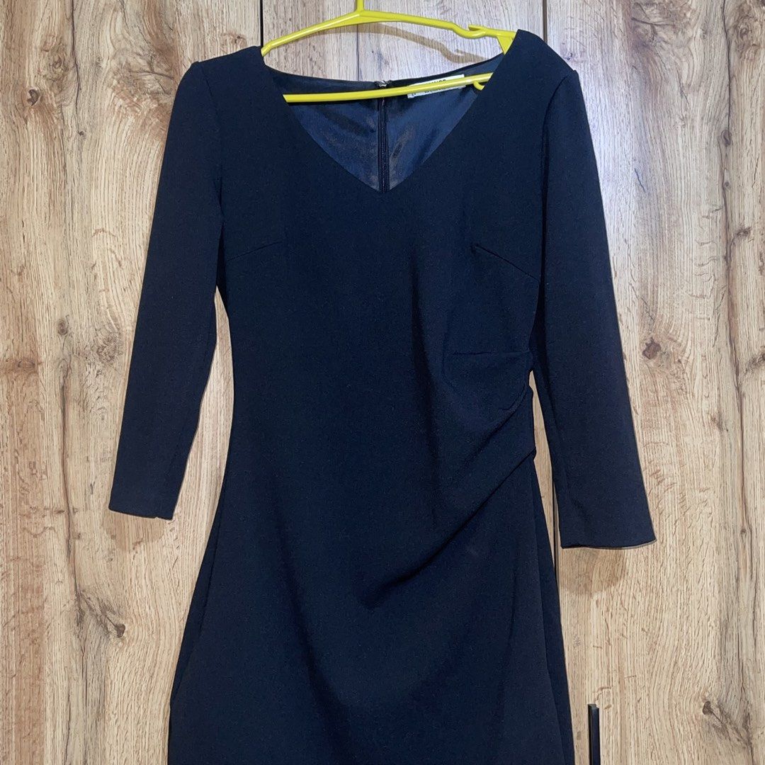 Mango Suit Collection Black V-Neck Dress (Category: Dresses) located in Manila. Submitted by cluttercleanwme (Listing ID 1467582543, Image 2). Description: Black dress from Mango Suit Collection. V-neckline with 3/4 sleeves. Asymmetric side draping detail and subtle ruching along the waistline. Back zipper closure for easy wear. Size EUR S, USA 4, MEX CH. Made in Vietnam. Clean silhouette suitable for work or evening events..